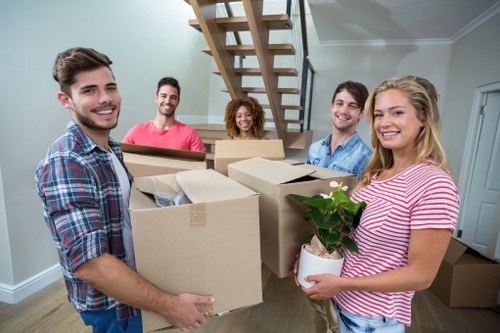 Professional movers loading a van for flat removals in Arkley