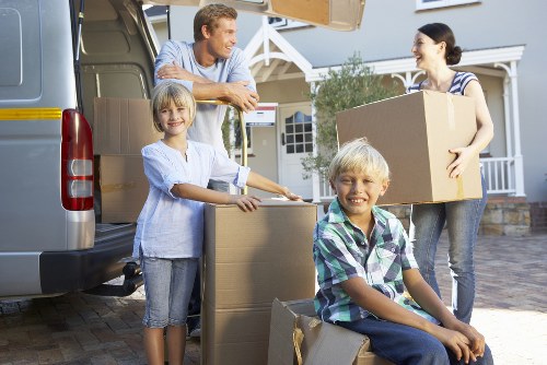 Furniture being carefully carried down stairs during a flat move